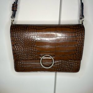 This is a brown snake skin ,small ,crossbody  purse ,never used ,and from h&m